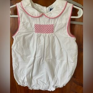Girl’s white bubble suit with smocking detail